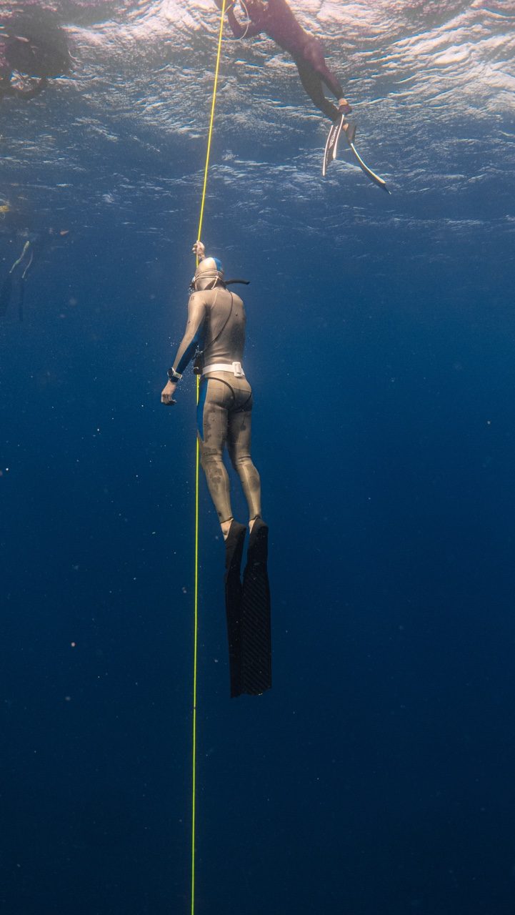 Freediver and safety diver ascending on a training line